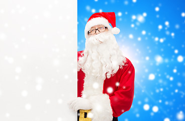 Image showing man in costume of santa claus with billboard