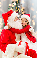 Image showing smiling little girl with santa claus