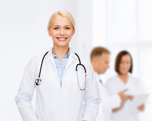 Image showing smiling female doctor with stethoscope