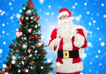 Image showing santa claus with bag and christmas tree