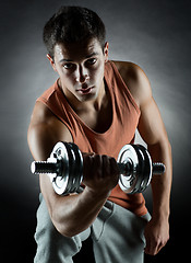 Image showing young man with dumbbell