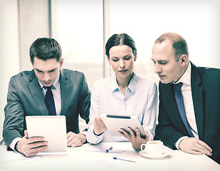 Image showing business team with tablet pc having discussion