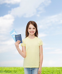 Image showing smiling little girl with ticket and passport