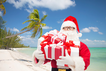 Image showing man in costume of santa claus with gift boxes