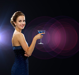 Image showing smiling woman holding cocktail