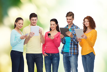 Image showing group of teenagers with smartphones and tablet pc