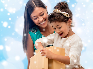 Image showing happy mother and child girl with gift box