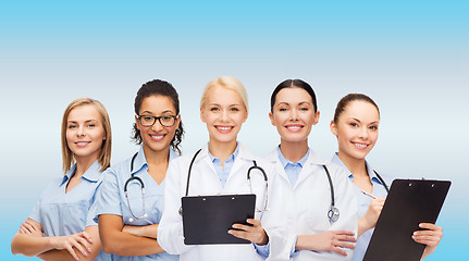 Image showing smiling female doctors and nurses with stethoscope