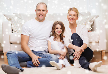 Image showing smiling parents and little girl at home