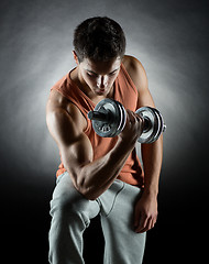 Image showing young man with dumbbell