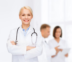 Image showing smiling female doctor with stethoscope