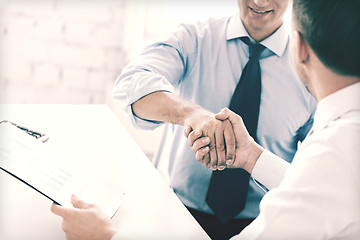 Image showing businessmen shaking hands in office