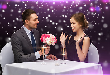 Image showing smiling couple course at restaurant