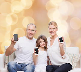 Image showing happy family with smartphones