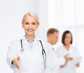 Image showing smiling female doctor with stethoscope