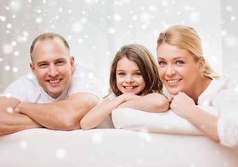 Image showing smiling parents and little girl at home