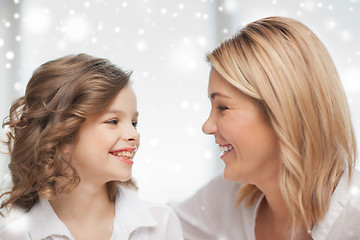 Image showing happy mother and daughter talking