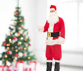 Image showing man in costume of santa claus showing thumbs up