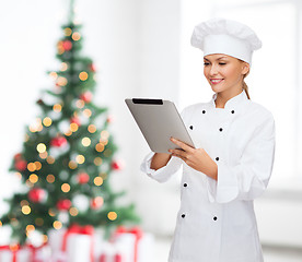 Image showing smiling female chef with tablet pc computer