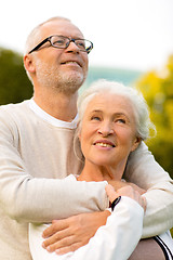 Image showing senior couple hugging in park