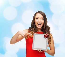 Image showing smiling woman in red dress with tablet pc