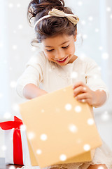 Image showing smiling little girl with gift box