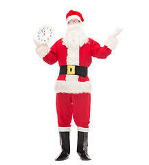 Image showing man in costume of santa claus with clock