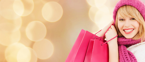 Image showing smiling young woman with shopping bags