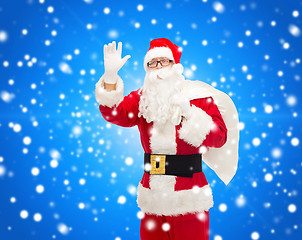 Image showing man in costume of santa claus with bag