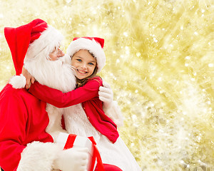 Image showing smiling little girl with santa claus