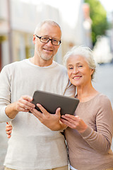 Image showing senior couple photographing on city street