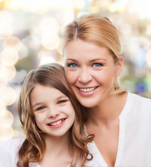 Image showing smiling mother and little girl