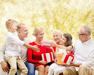 Image showing smiling family with gifts