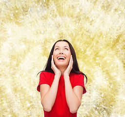 Image showing smiling woman in red dress