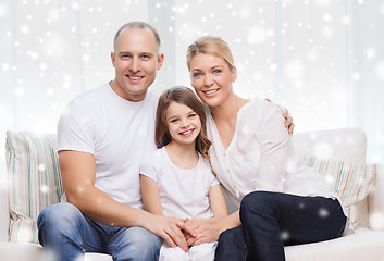 Image showing smiling parents and little girl at home