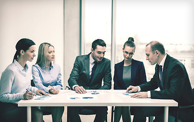 Image showing business team with documents having discussion