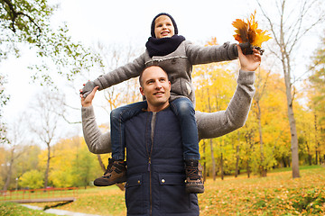 Image showing happy family having fun in autumn park