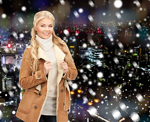 Image showing smiling young woman in winter clothes