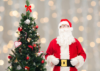 Image showing man in costume of santa claus with christmas tree