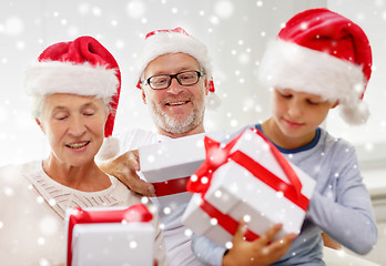 Image showing happy family sitting on couch at home