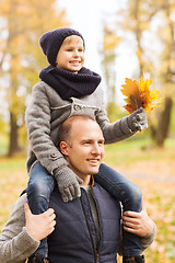 Image showing happy family having fun in autumn park