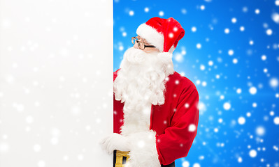 Image showing man in costume of santa claus with billboard