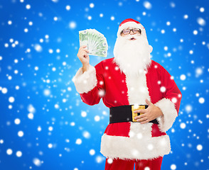 Image showing man in costume of santa claus with euro money