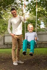 Image showing happy family in front of house outdoors