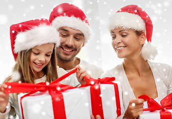 Image showing happy family sitting on couch at home