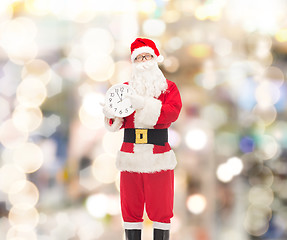 Image showing man in costume of santa claus with clock