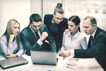 Image showing business team with laptop having discussion