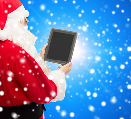 Image showing man in costume of santa claus with tablet pc