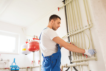 Image showing builder or plumber working indoors