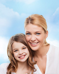 Image showing smiling mother and little girl